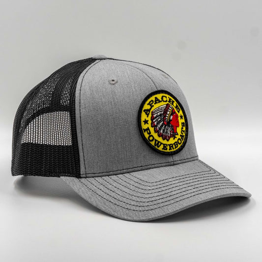 Gray and black trucker cap with a logo on a light gray background