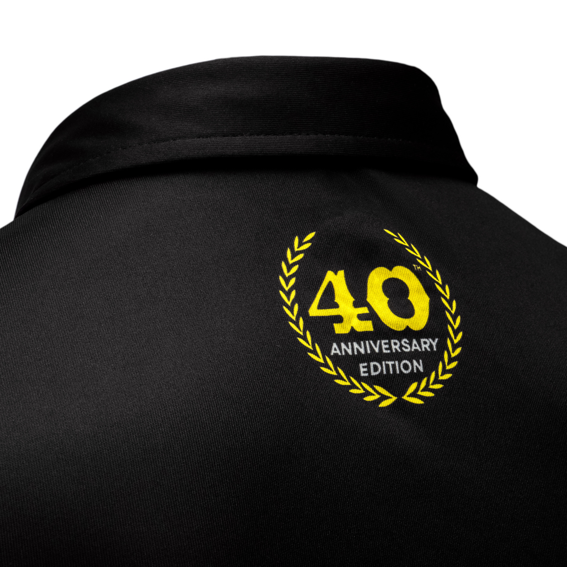 Detail of 40th Anniversary logo on the back collar area of Apache performance polo